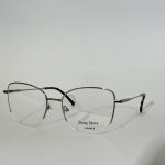 Elegant women's optical glasses with sleek metal frame.