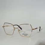 Elegant women's optical glasses with gold frames on white background.