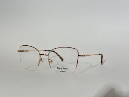 Elegant women's optical frames with gold accents on white background.