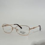 Elegant women's optical frames with gold accents, Daisy Store branding.