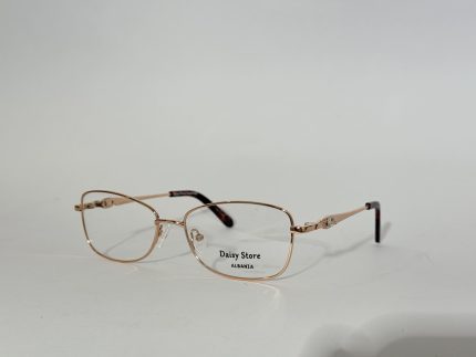 Elegant women's optical frames with gold accents, Daisy Store branding.
