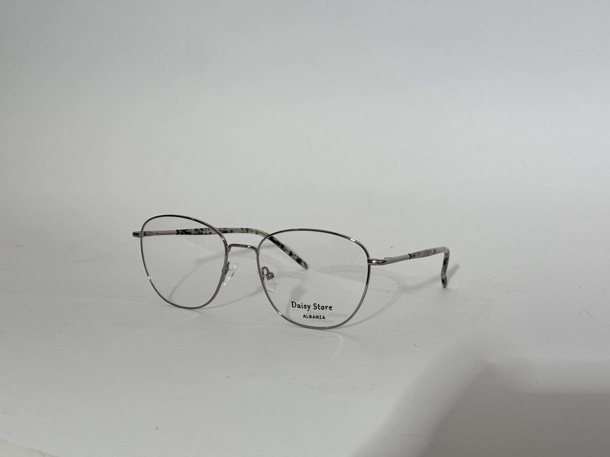 ds-syze-optike-074-kryesore Elegant women's optical frames with thin metal design.