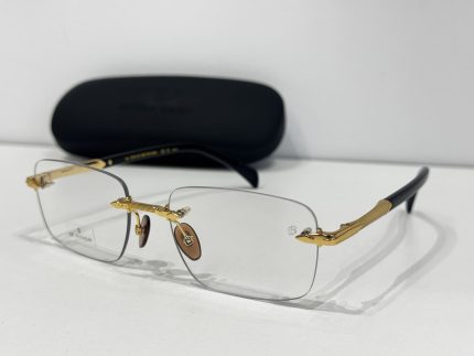 Skelete Optike David Beckham glasses with gold accents and case.