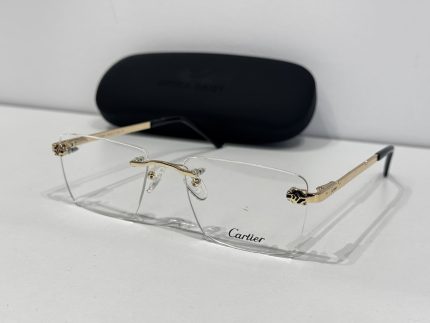Skelete Optike Cartier rimless glasses with gold accents and case.