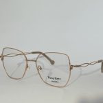 Elegant women's optical glasses with gold frames from Daisy Store.