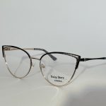 Elegant women's optical glasses with black and gold frames.