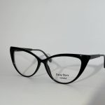 Elegant women's optical glasses with black cat-eye frames.