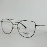 Modern women's optical glasses with sleek metal frame.