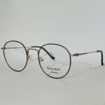 Women's stylish optical glasses with round metal frames.