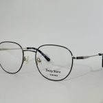 Modern women's optical glasses with sleek metal frame.