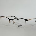 Women's elegant optical glasses with black and gold frame.