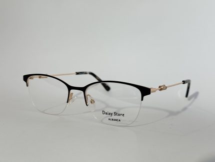 Women's elegant optical glasses with black and gold frame.
