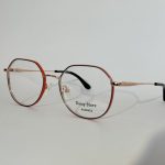 Elegant women's optical glasses with thin metal frames.