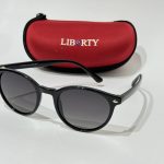 Syze Dielli Liberty Origjinale sunglasses with red case on white background.