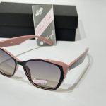 Anna Smith sunglasses with pink frames and gradient lenses.