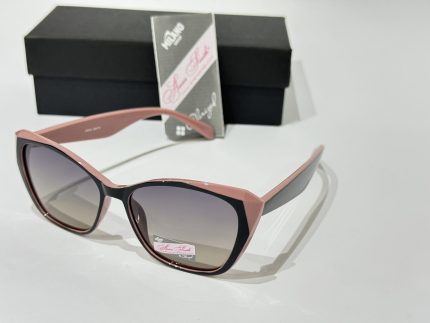 Anna Smith sunglasses with pink frames and gradient lenses.