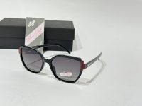 Anna Smith sunglasses with elegant black and red frame.
