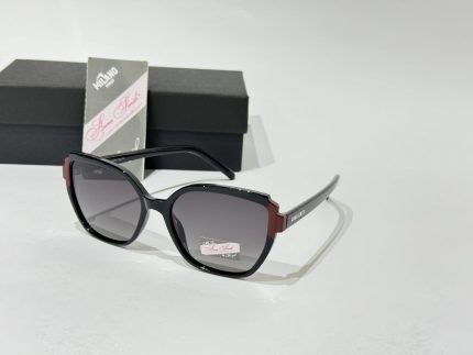 Anna Smith sunglasses with elegant black and red frame.
