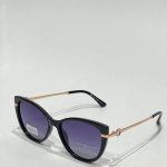 Syze dielli ari-zezë Polar Vision sunglasses with gold accents.