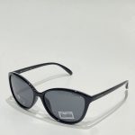 Syze Dielli Polar Vision black polarized sunglasses on white background.