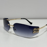 Miu Miu women's sunglasses, elegant gold and blue gradient lenses.