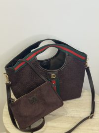 Gucci Ophidia GG shoulder bag with matching pouch on display.