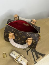 Louis Vuitton Speedy Bandouliere mini bag with monogram and shoulder strap.
