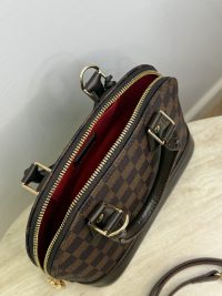 Louis Vuitton Alma BB handbag with shoulder strap, open view.