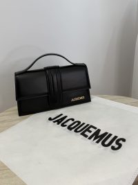 Black Jacquemus Le Bambino bag on branded cloth.