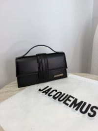 Cante Jacquemus Le Bambino black handbag on branded cloth.