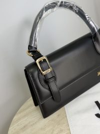 Black Jacquemus Le Chiquito Long handbag with gold buckle detail.
