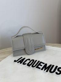 Gray Jacquemus Le Bambino mini bag on branded dust cover.