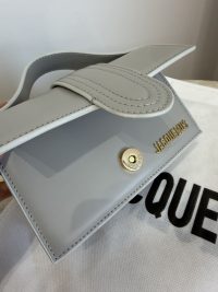 Elegant Mini Jacquemus Le Bambino bag in light gray leather.