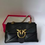 Black Pinko Love Bag with gold bird embellishment.