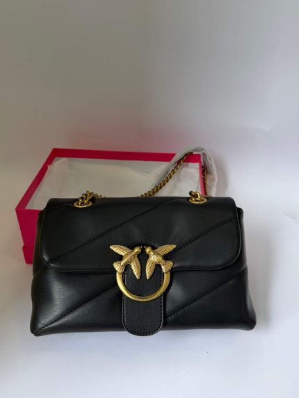 Black Pinko Love Bag with gold bird embellishment.