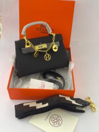 Hermès Mini Kelly women's handbag in box with accessories.