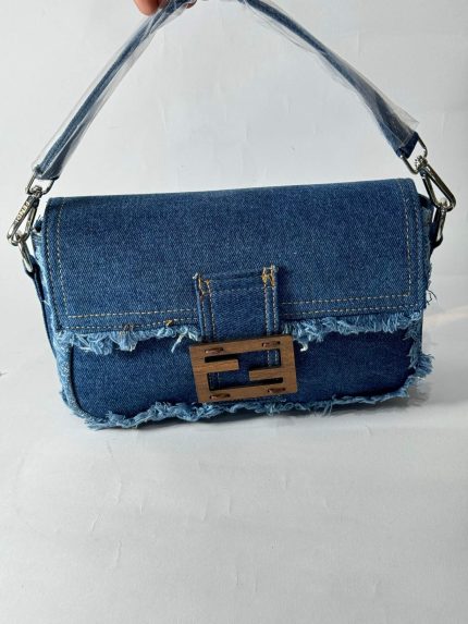 Fendi Baguette denim bag with frayed edges and metal buckle.
