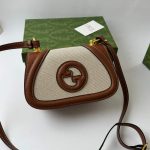 Gucci Blondie cream bag with brown leather accents and logo.
