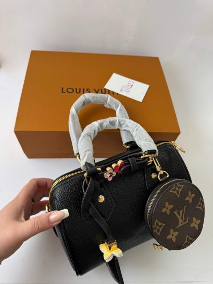 Black Louis Vuitton Speedy Bandoulière handbag with box and accessories.