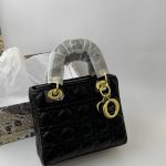 Black Dior Lady Dior Mini handbag with gold accents.
