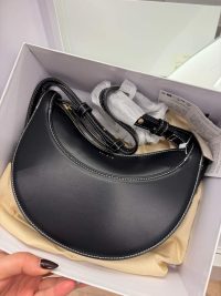 Polène Cyme Mini black handbag in box, elegant design for women.
