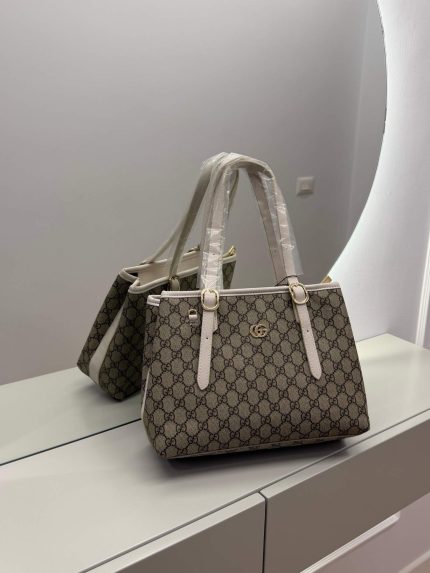 Gucci GG Supreme Tote bag with elegant monogram design on display.