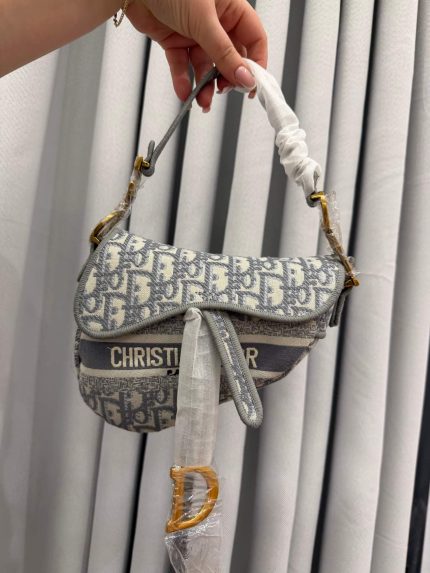 Dior Saddle Mini Oblique women's handbag with iconic monogram design.
