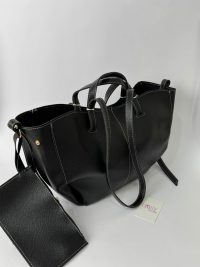 Black leather university bag with contrast stitching and pouch.