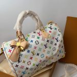 Louis Vuitton Speedy Bandoulière handbag with colorful monogram design.