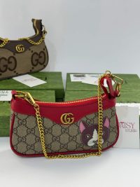 Gucci Ophidia Mini bag with gold chain and dog motif.