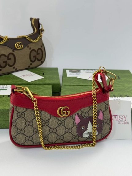 Gucci Ophidia Mini bag with gold chain and dog motif.