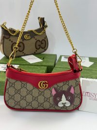 Gucci Ophidia Mini bag with gold chain and cat design.