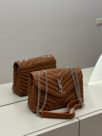 Brown Saint Laurent Loulou bag with silver chain on display.