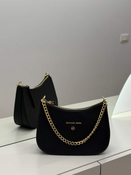 Black Michael Kors hobo bag with gold chain detail.